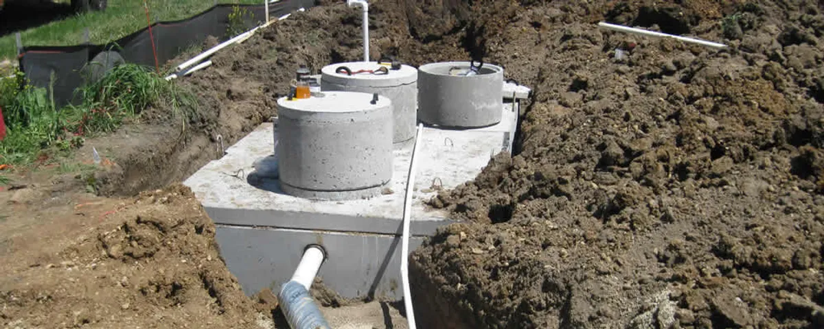 Septic system repair and installation site with tank access ports in Bakersfield, CA